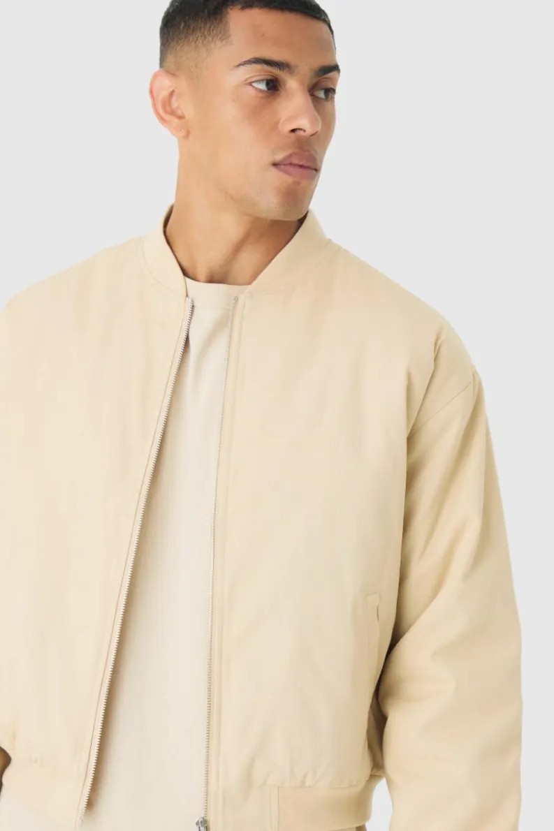 Shop boohooMAN Boxy OFCL Applique Twill Padded Bomber Jacket In stone