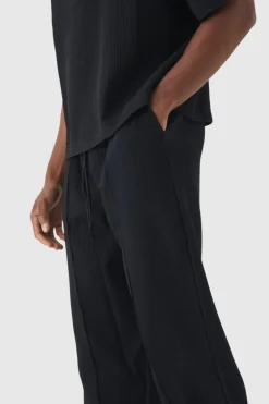 Store boohooMAN Elasticated Waist Relaxed Fit Pleated Trouser black