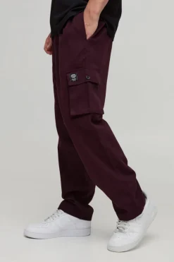 Store boohooMAN Elasticated Waist Skate Cropped Woven Tab Trousers burgundy
