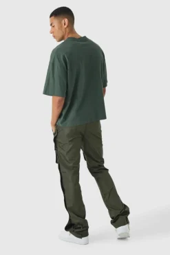 Shop boohooMAN Elasticated Waist Slim Flare Stacked Cargo Trousers khaki