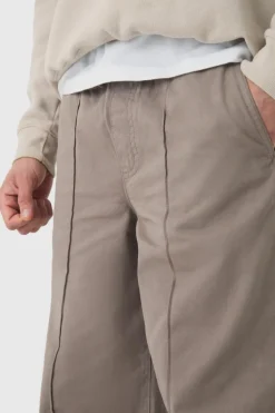 Shop boohooMAN Elasticated Waist Wide Leg Pintuck Chino Trousers taupe