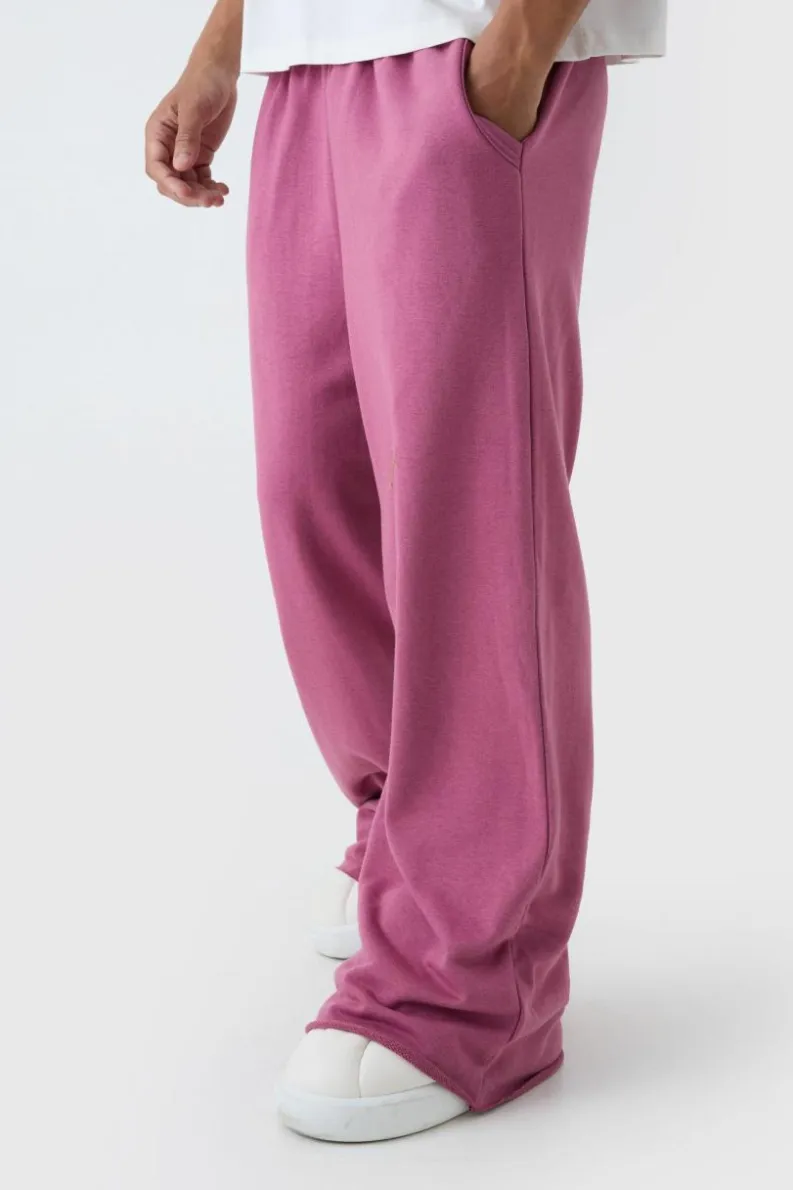 Shop boohooMAN Extreme Wide Leg Raw Edge Loopback Jogger mauve