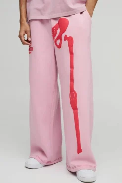 Shop boohooMAN Extreme Wide Leg Skeleton Puff Print Jogger pink