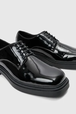 Shop boohooMAN Faux Leather Derby Shoes In black