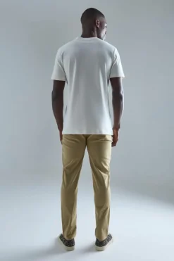 Shop boohooMAN Fixed Waist Slim Fit Technical Stretch Trouser stone