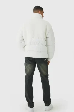 Store boohooMAN Half Zip Borg And Nylon Funnel Neck Puffer Jacket In ecru