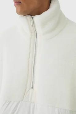 Store boohooMAN Half Zip Borg And Nylon Funnel Neck Puffer Jacket In ecru