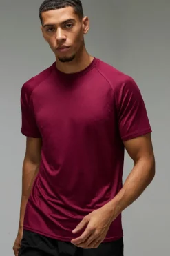 Shop boohooMAN Man Active Lightweight Essentials Gym Raglan T-shirt burgundy