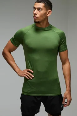 Shop boohooMAN Man Active Lightweight Essentials Gym Muscle Fit Raglan T-shirt green