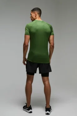 Shop boohooMAN Man Active Lightweight Essentials Gym Muscle Fit Raglan T-shirt green