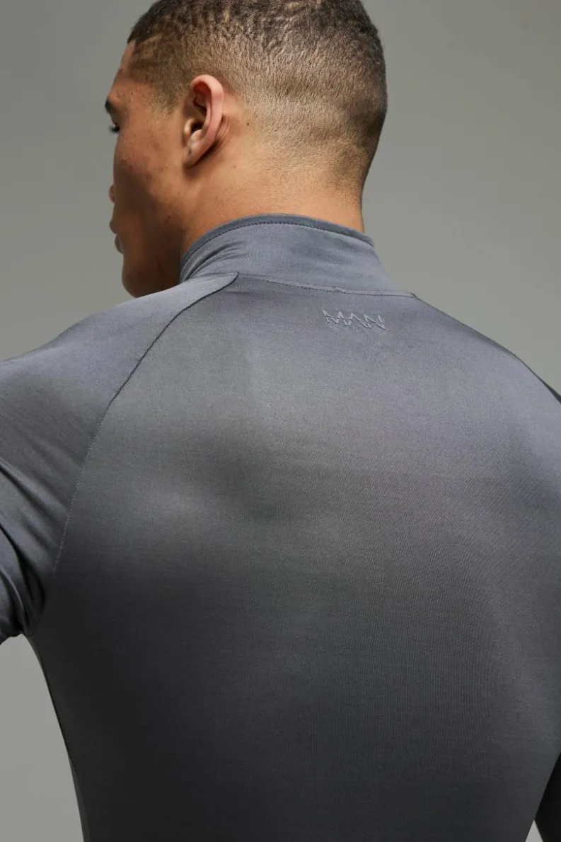 Shop boohooMAN Man Active Lightweight Essentials Gym Raglan Muscle Fit 1/4 Zip charcoal