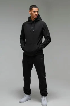 Store boohooMAN Man Active Regular Fit Badge Tracksuit black