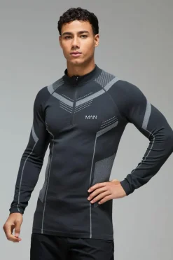 Shop boohooMAN Man Active Seamless Muscle Fit 1/4 Zip Top black