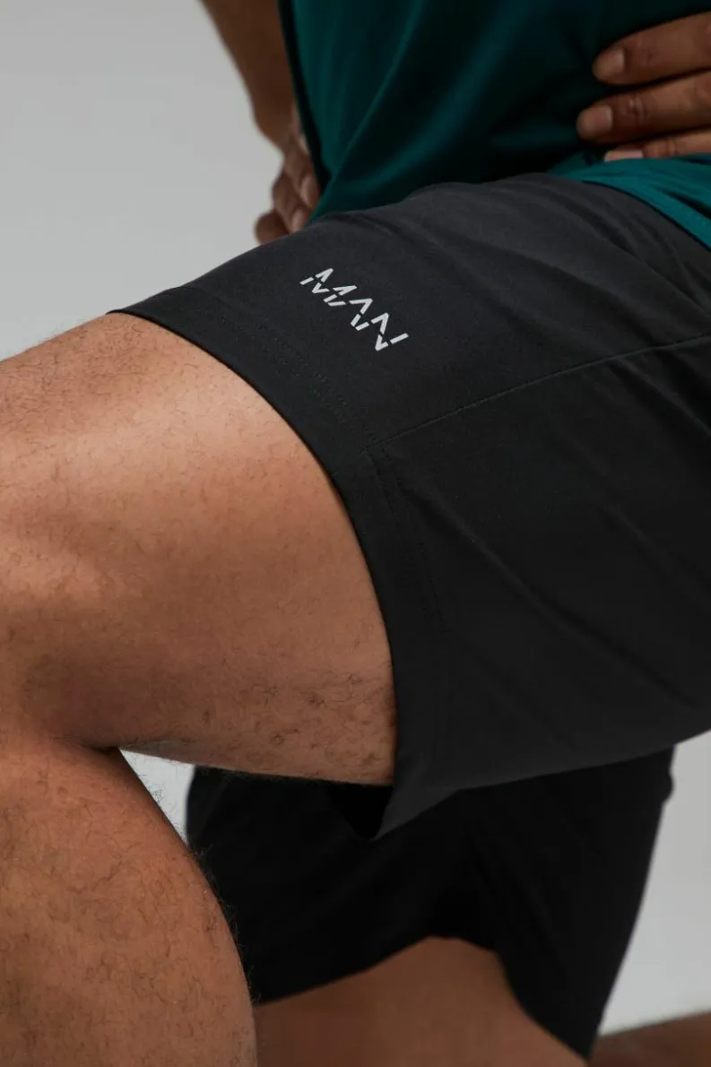Shop boohooMAN Man Active Stretch Woven 7inch Short black