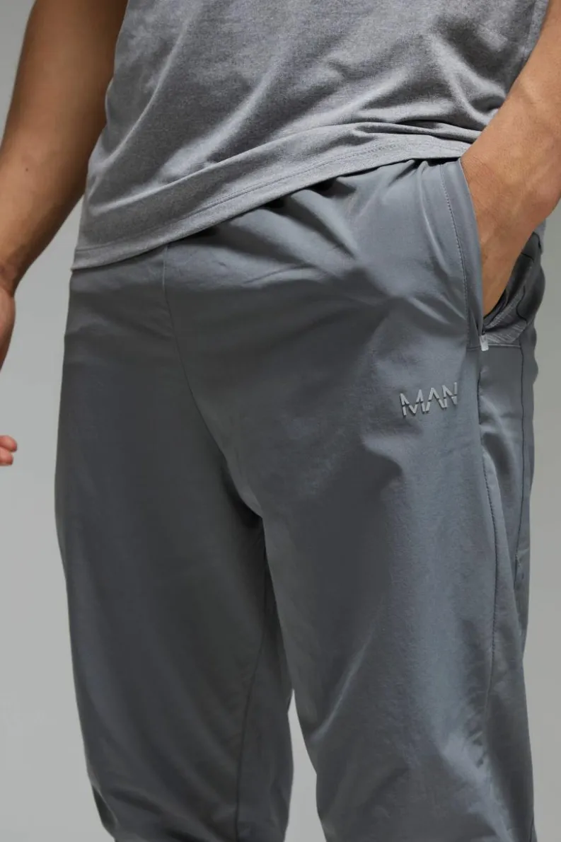 Discount boohooMAN Man Active Stretch Woven Tapered Joggers charcoal