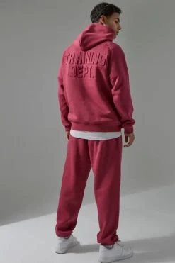 Store boohooMAN Man Active Training Dept Oversized Embossed Jogger berry