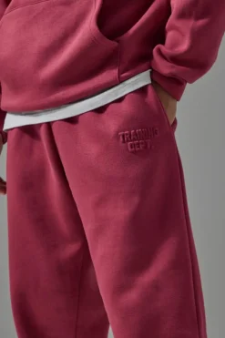 Store boohooMAN Man Active Training Dept Oversized Embossed Jogger berry