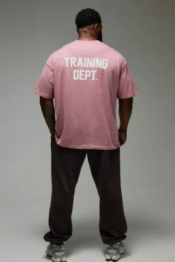 Shop boohooMAN Man Active Training Dept. Oversized T-shirt pink