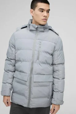 Shop boohooMAN Mid Length Hooded Puffer In grey