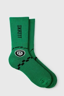 Shop boohooMAN Moto Racing Flag Socks green