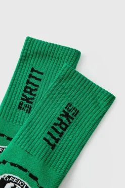 Shop boohooMAN Moto Racing Flag Socks green