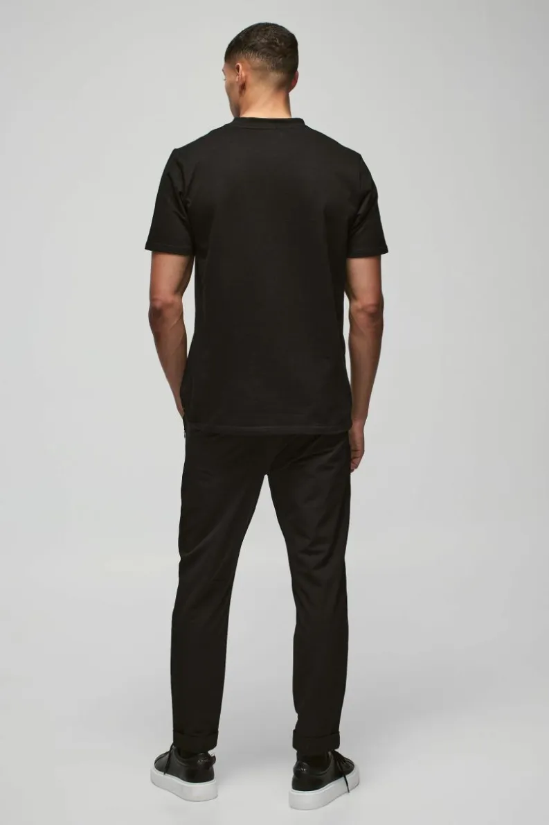 Shop boohooMAN Nylon Technical Stretch Slim Trouser black