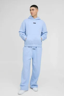 Fashion boohooMAN Oversized Boxy Drop Crotch Hooded Tracksuit With Rubber Badge light blue