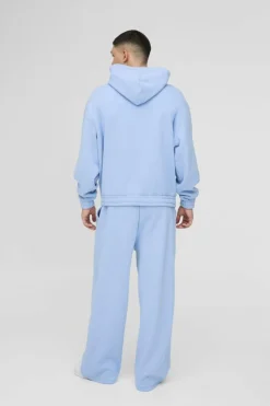 Fashion boohooMAN Oversized Boxy Drop Crotch Hooded Tracksuit With Rubber Badge light blue