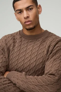 Shop boohooMAN Oversized Boxy Fit Cable Knit Jumper taupe