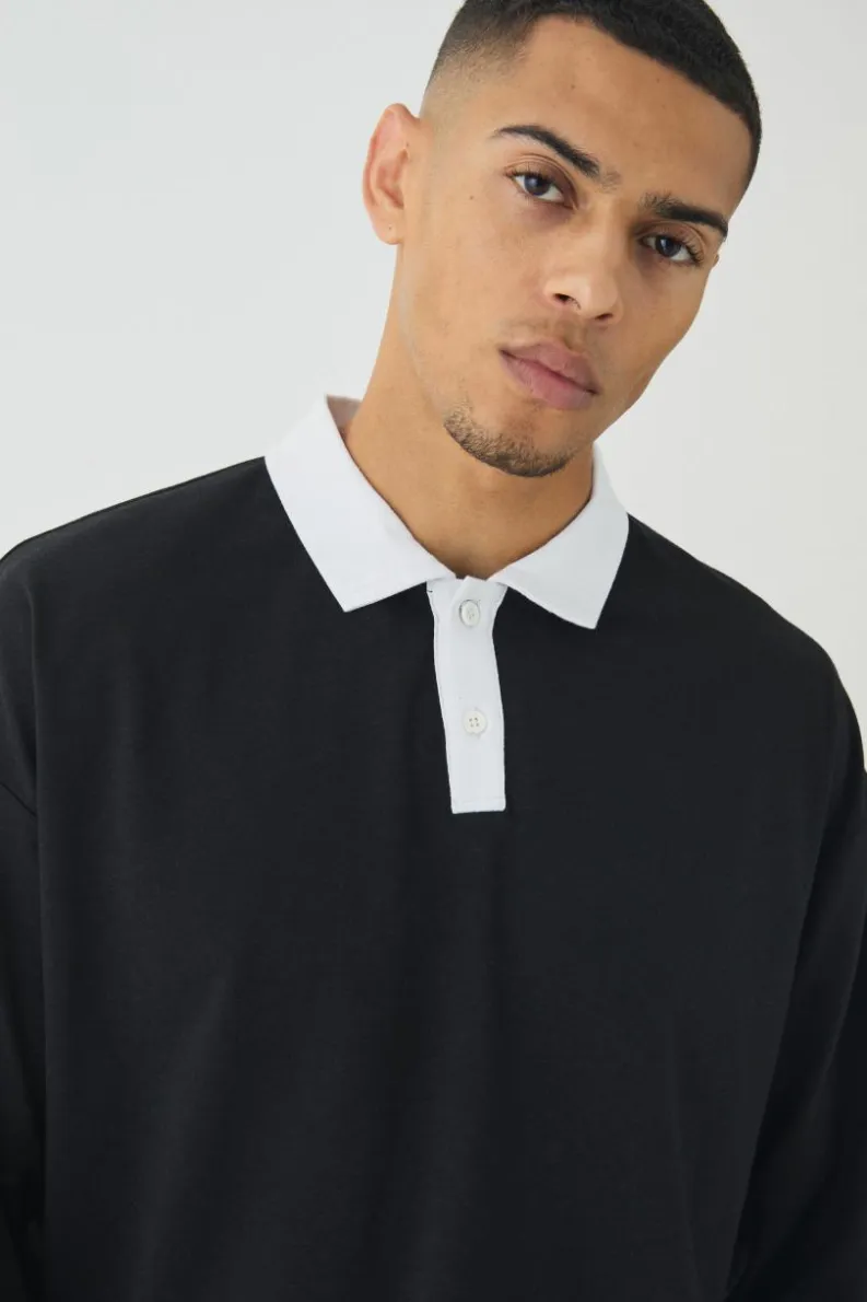 Shop boohooMAN Oversized Boxy Long Sleeve Contrast Polo black