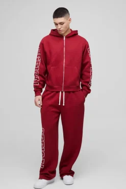 Shop boohooMAN Oversized Boxy Official Zip Through Hooded Tracksuit burgundy