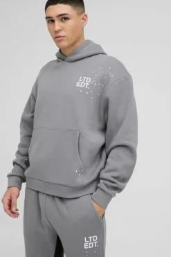 Store boohooMAN Oversized Boxy Paint Splatter Gusset Hooded Tracksuit charcoal