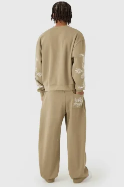 Shop boohooMAN Oversized Boxy Paisley Print Sweatshirt Tracksuit taupe