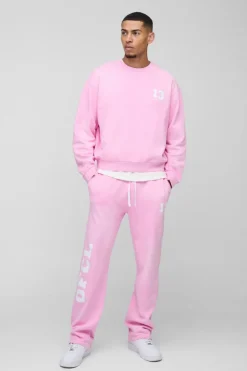 Discount boohooMAN Oversized Boxy Spray Wash Ofcl Printed Sweat Tracksuit pink