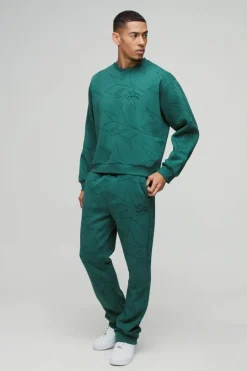 Shop boohooMAN Oversized Boxy Star All Over Printed Sweat Tracksuit forest