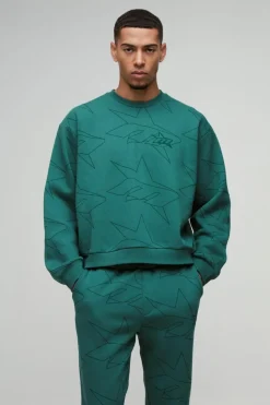 Shop boohooMAN Oversized Boxy Star All Over Printed Sweat Tracksuit forest