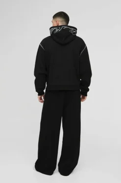 Shop boohooMAN Oversized Boxy Twill Applique Contrast Stitch Hoodie black