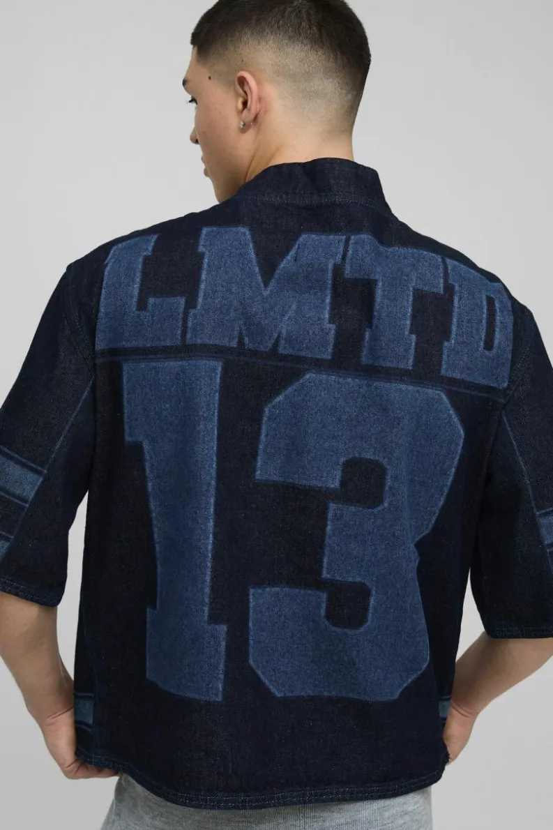 Shop boohooMAN Oversized Boxy V Neck Laser Print Football Top indigo