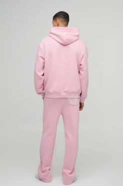 Hot boohooMAN Oversized Cold Hearted Puff Print Gusset Flare Hooded Tracksuit pink
