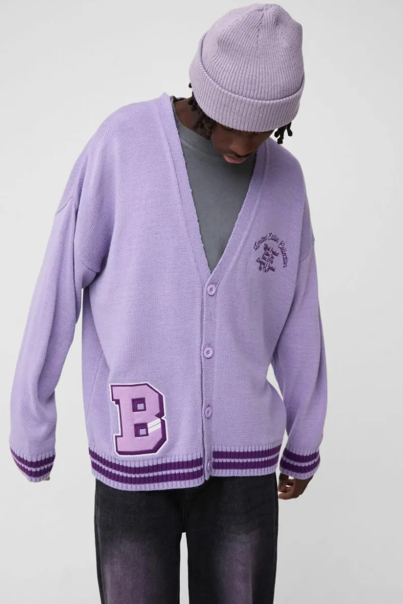Shop boohooMAN Oversized Drop Shoulder Varsity Applique Knitted Cardigan purple