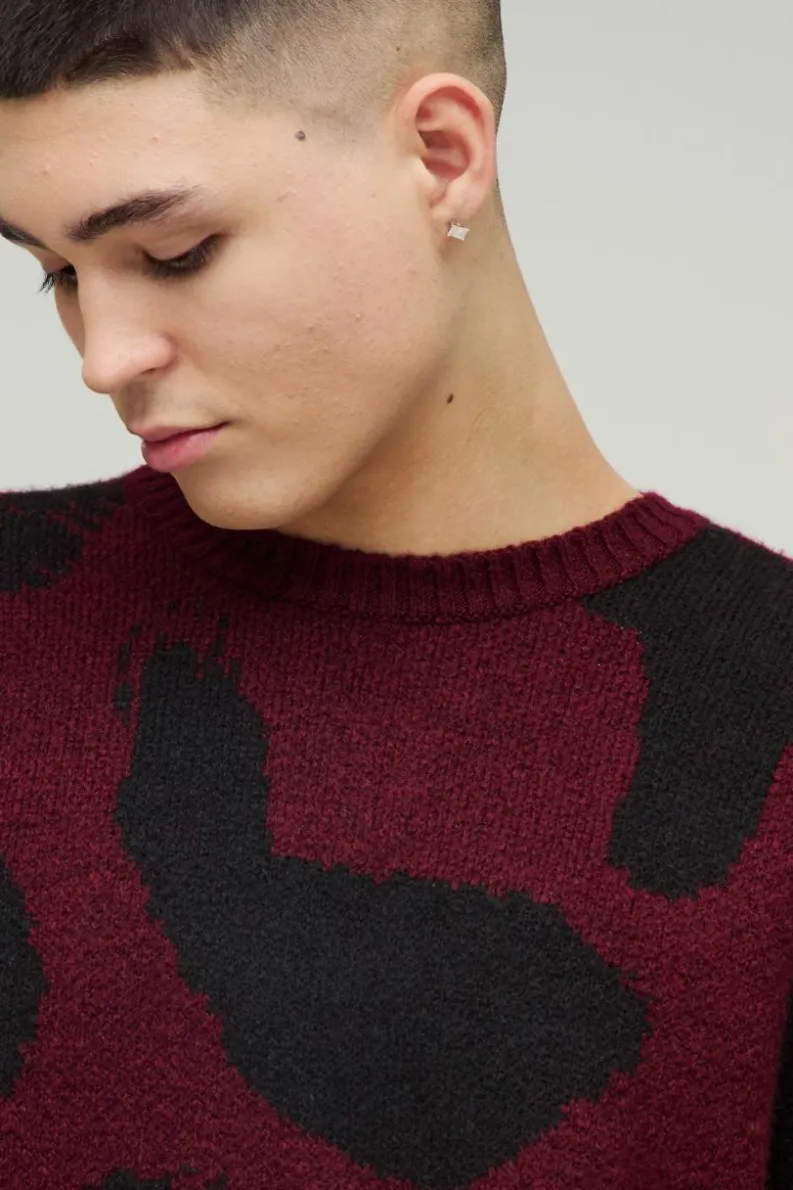 Shop boohooMAN Oversized Eyelash Knit Leopard Print Knitted Jumper burgundy