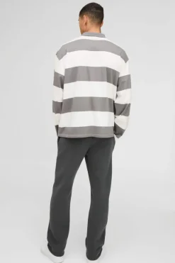 Shop boohooMAN Oversized Long Sleeve Stripe Homme Printed Rugby Polo charcoal