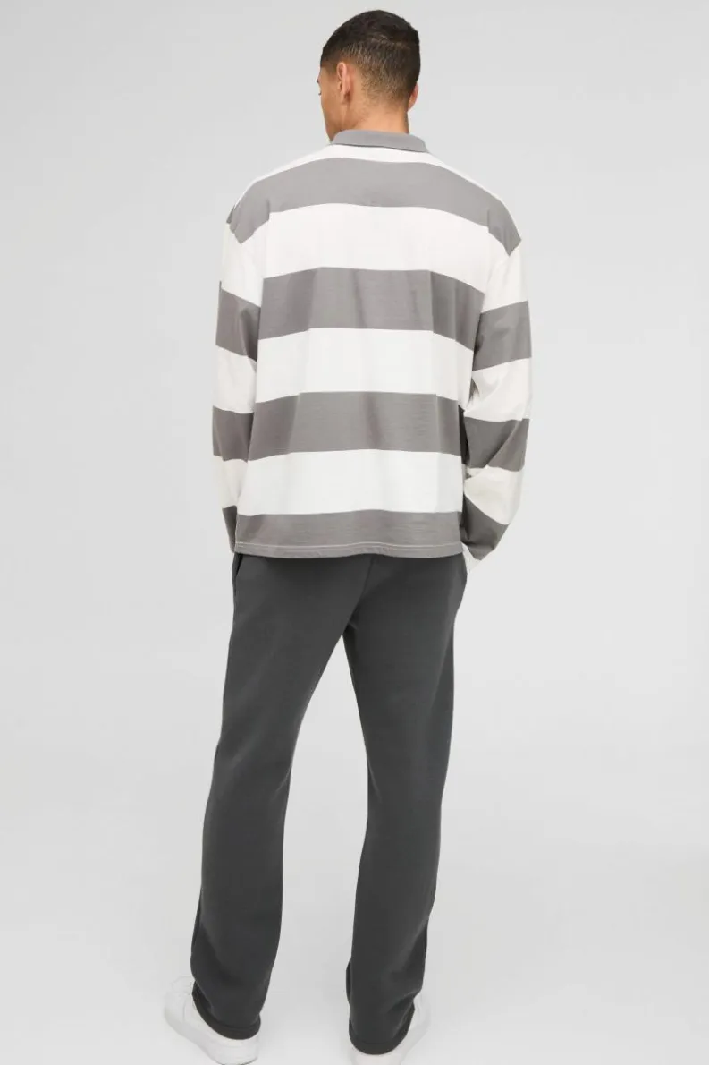 Shop boohooMAN Oversized Long Sleeve Stripe Homme Printed Rugby Polo charcoal