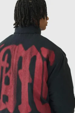 New boohooMAN Oversized Spray M Print Funnel Neck Puffer Jacket In black