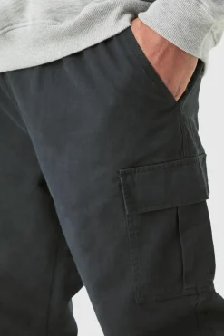 Shop boohooMAN Plus Elasticated Waist Slim Fit Cargo Trousers black