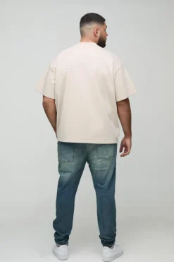 Shop boohooMAN Plus Extreme Rip Busted Knee Skinny Jeans mid wash