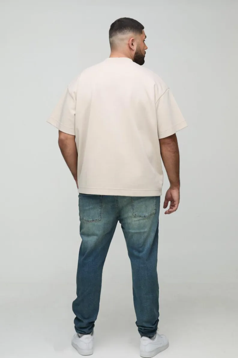 Shop boohooMAN Plus Extreme Rip Busted Knee Skinny Jeans mid wash