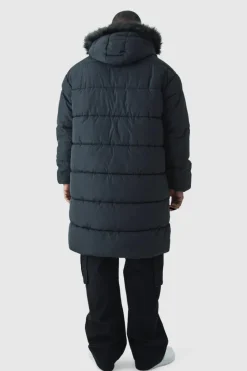 Online boohooMAN Plus Longline Faux Fur Hooded Puffer Jacket In black