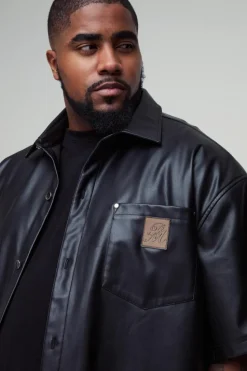 Shop boohooMAN Plus Oversized PU Pocket Detail Shirt black