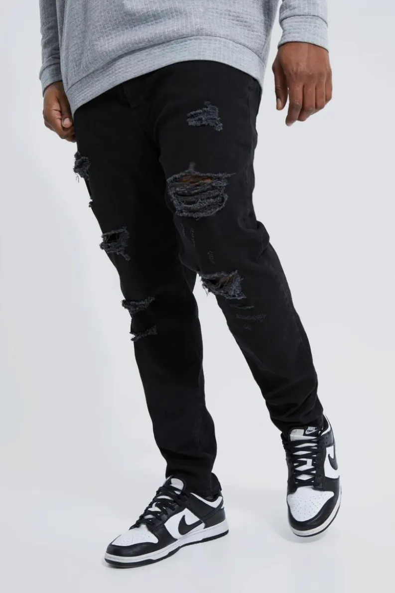 Shop boohooMAN Plus Skinny Stretch All Over Rip Jeans true black